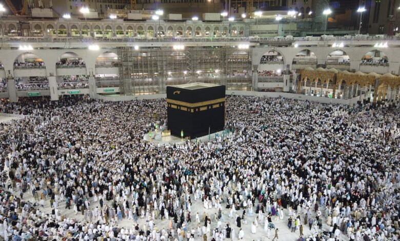 A Group of People Standing Near the Kaaba